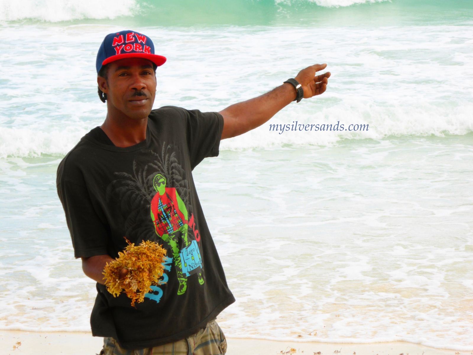 Mushtaq, local fisherman, with the sargassum