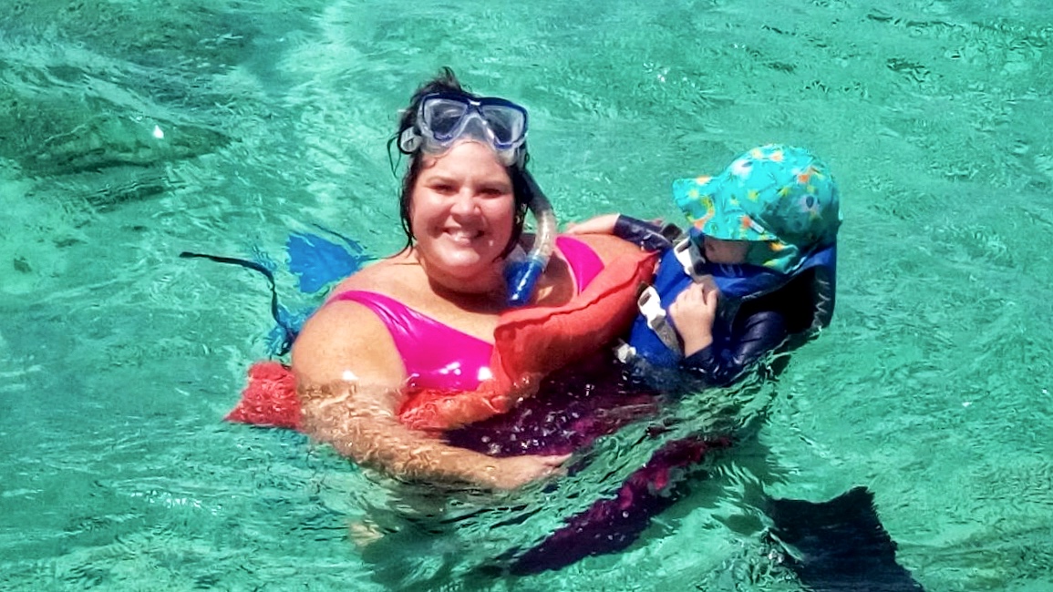 woman and toddler in sea