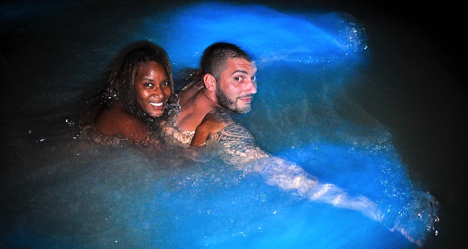 woman on man's back in lagoon