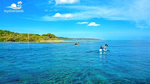 kayaks and silver sands in the distance