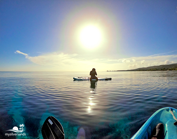 bryan getting ready sitting on paddle board