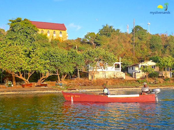 Rio Bueno Baptist Church and fishermen in boat