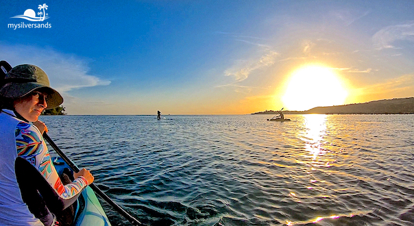 lea looking back as she kayaks out to sea