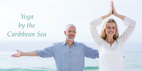 middle-aged couple doing yoga on the beach