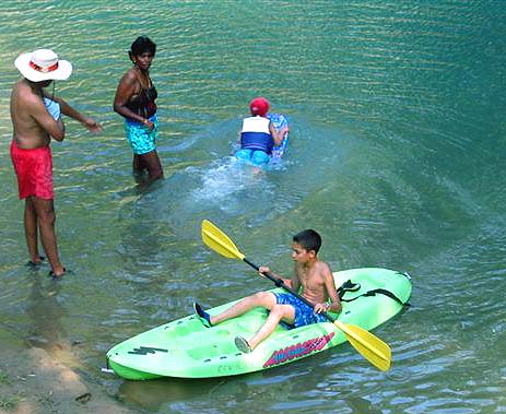 Damayanthi watches Lal in kayak.