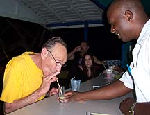 Kelly serves Roger at the bar