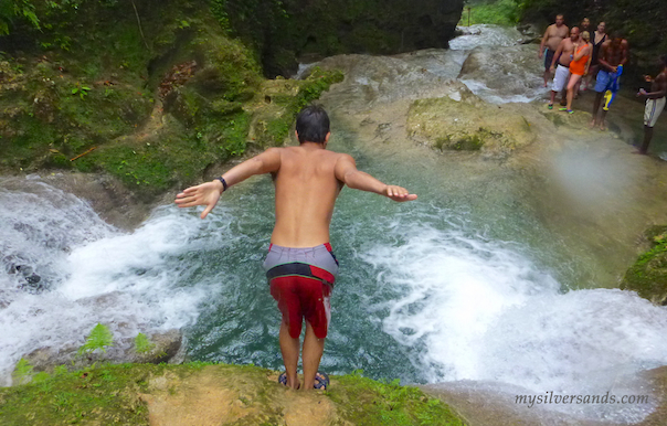 getting ready to jump in the pool from the watefall at blue hole in jamaica