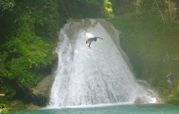 diver from the top of the waterfall at blue hole