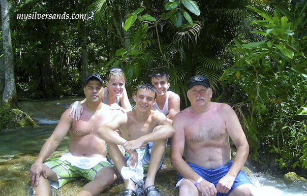 watkins group sitting at the top of dunns river falls jamaica ocho rios