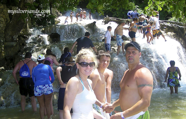 on the beach at the start of the climb up dunns river falls in ocho rios jamaica