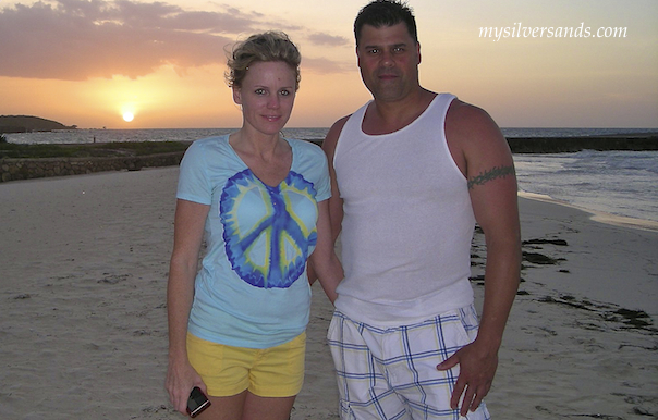 couple enjoying sunset on silver sands beach jamaica