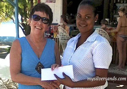 gift certificate presentation to guest on the silver sands patio for bob marley trivia quiz