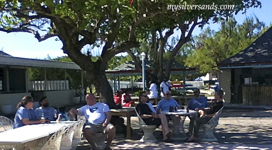 guests relaxing on the patio for the bob marley birthday celebration 2011