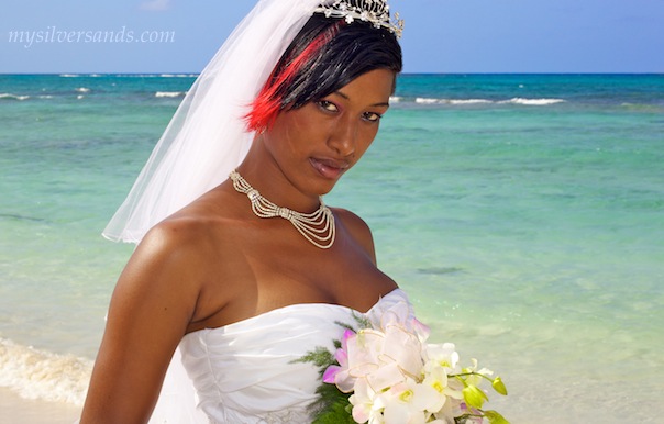 bride on the beach at rum jetty in silver sands jamaica