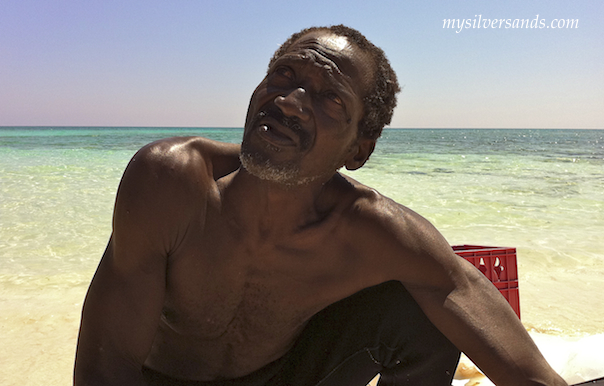 shine, the conch man, on the beach at silver sands villas jamaica