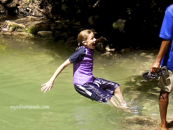 child falling in dunns river falls jamaica