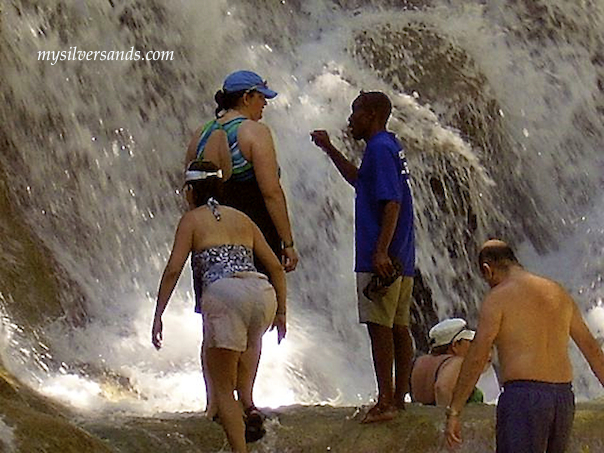 guide with visitors at dunn''s river falls jamaica