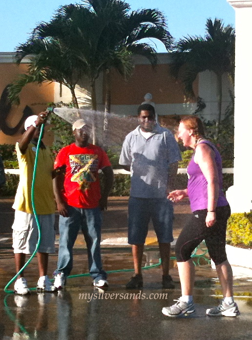 getting sprayed with garden hose at reggae marathon 2010 negril jamaica