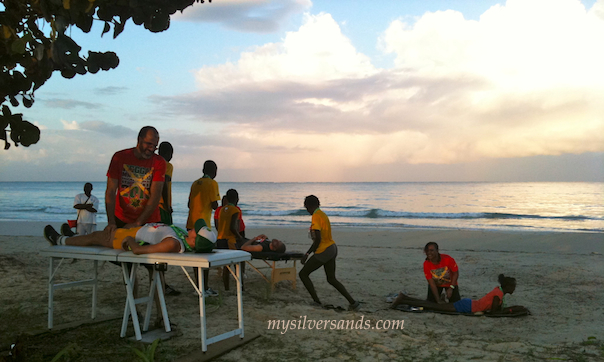getting massages on the beach negril jamaica reggae marathon 2010