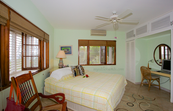 bedroom 3 of rockhill villa is furnished with a king bed.