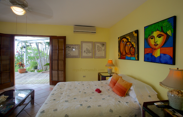 bedroom 5 of rock hill villa is furnished with a queen size bed.