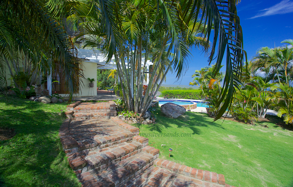 view of pools at rock hill villa from entrance steps