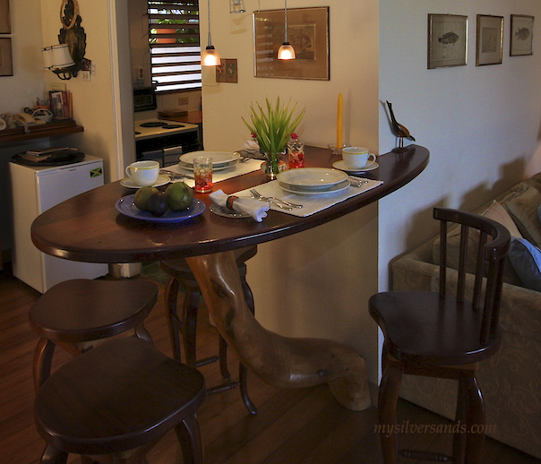 breakfast bar with tree trunk table at seashell cottage in silver sands jamaica