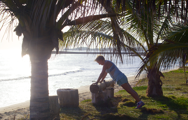 push-ups or press-ups on a log on the seafront