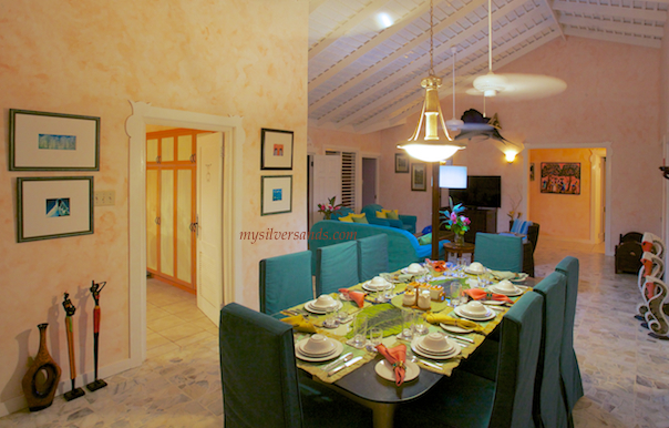 summertime dining room opens out to the verandah and pool deck